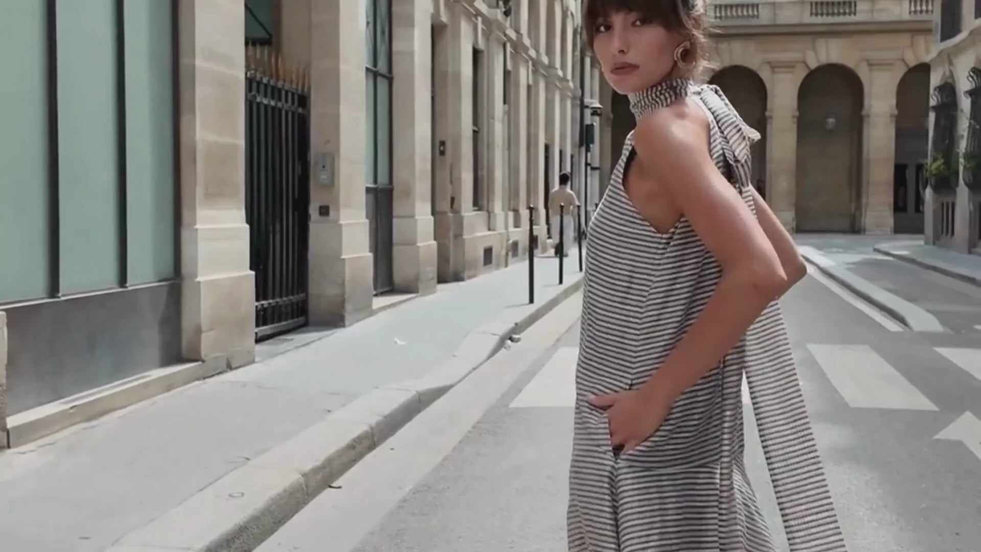 Model wearing the Zandra Stone Victoria Scarf Dress - Brown Plaid in an editorial city setting.